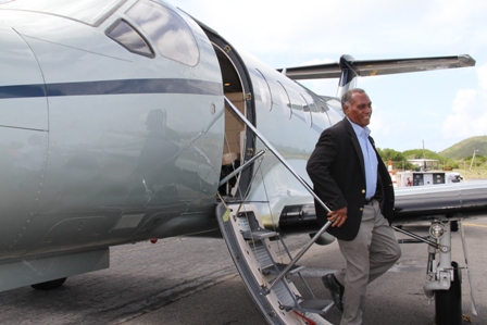 Premier of Nevis Hon. Vance Amory alights from an aircraft at a ceremony at the Vance Amory International Airport in Newcastle, to mark the inaugural launch of Tradewind Aviation’s daily nonstop services from San Juan, Puerto Rico to Nevis